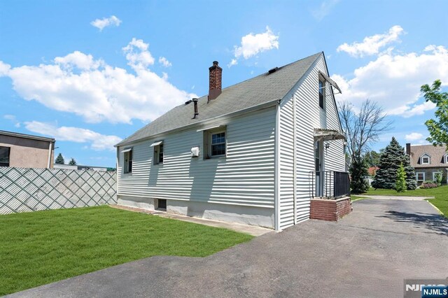 837 Keep St, Linden, NJ 07036 - rear view of house featuring a chimney, roof with shingles, and a patio