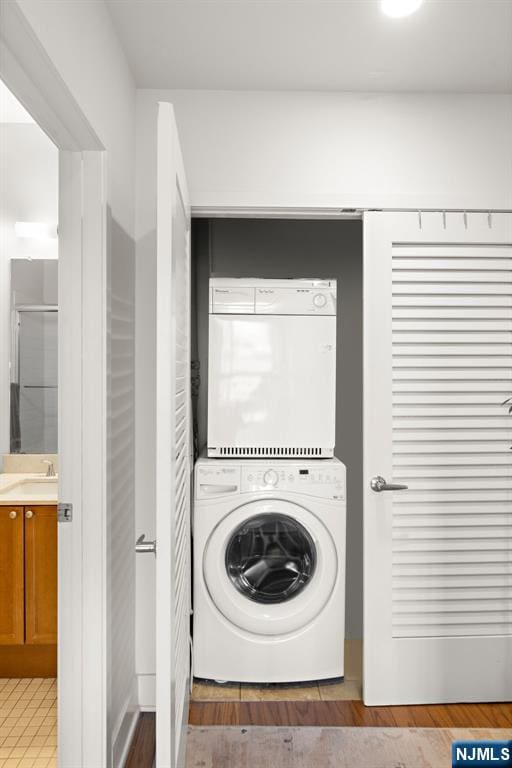 201 Marin Blvd Unit 1209, Jersey City, NJ 07302 - washroom featuring stacked washer and clothes dryer
