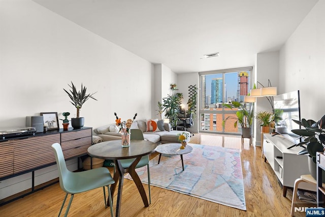 201 Marin Blvd Unit 1209, Jersey City, NJ 07302 - living area with floor to ceiling windows and wood finished floors
