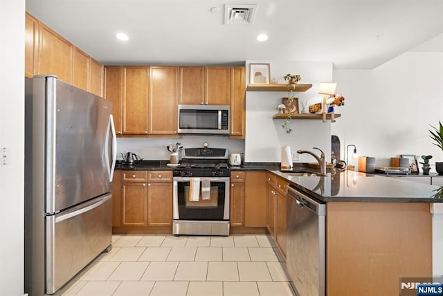 201 Marin Blvd Unit 1209, Jersey City, NJ 07302 - kitchen featuring appliances with stainless steel finishes, a peninsula, recessed lighting, open shelves, and brown cabinets