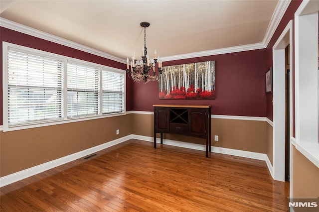 29 Concord Rd Unit F, West Milford, NJ 07480 - unfurnished dining area featuring a chandelier, wood finished floors, and crown molding