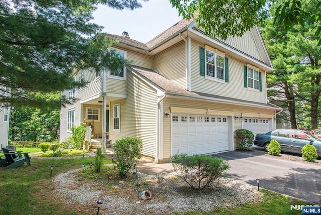 90 Warbler Dr, Wayne, NJ 07470 - traditional home with a garage, asphalt driveway, and a shingled roof