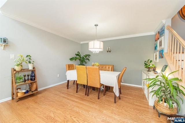 90 Warbler Dr, Wayne, NJ 07470 - dining space with light wood finished floors, stairway, crown molding, and a chandelier