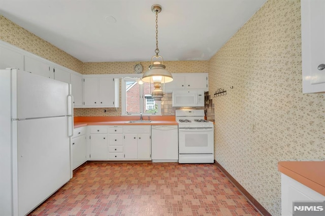 33 Ravine Dr, Hawthorne, NJ 07506 - kitchen featuring white appliances, wallpapered walls, light countertops, white cabinets, and pendant lighting