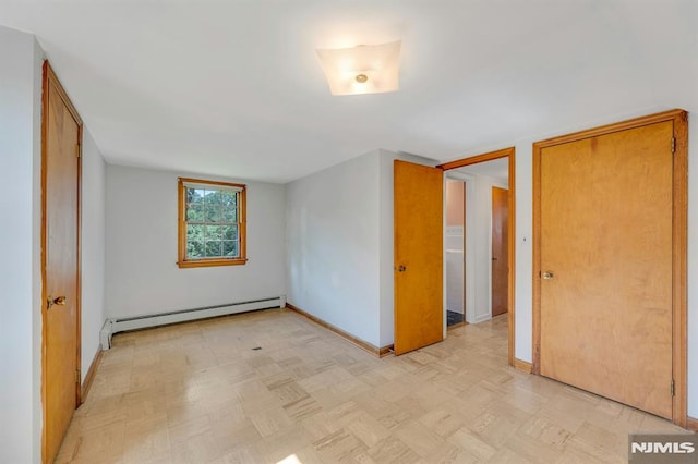 33 Ravine Dr, Hawthorne, NJ 07506 - unfurnished bedroom with a baseboard radiator and baseboards