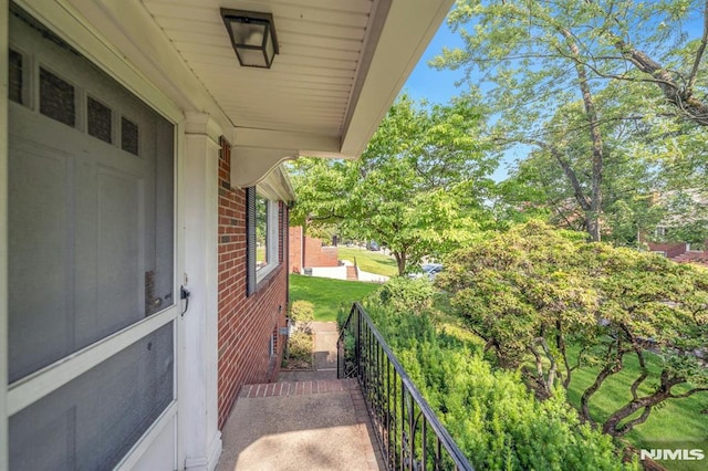 33 Ravine Dr, Hawthorne, NJ 07506 - view of home's exterior featuring brick siding and view of wooded area