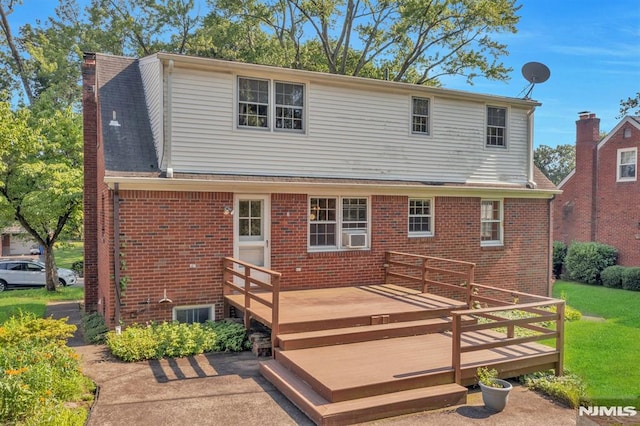 33 Ravine Dr, Hawthorne, NJ 07506 - back of property featuring brick siding, a deck, and a lawn