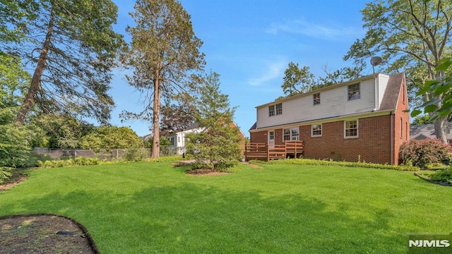 33 Ravine Dr, Hawthorne, NJ 07506 - back of house featuring a wooden deck and brick siding