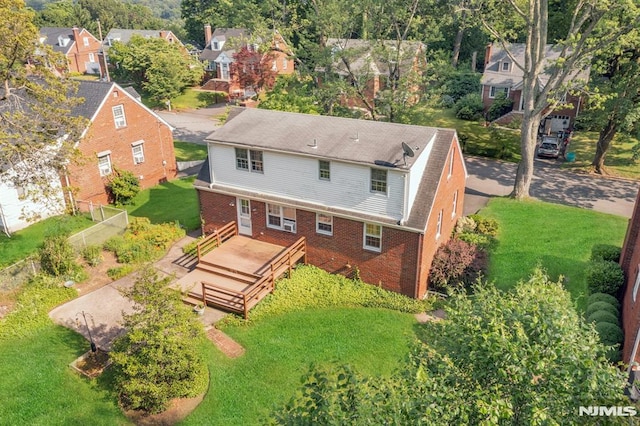 33 Ravine Dr, Hawthorne, NJ 07506 - rear view of house featuring brick siding, a wooden deck, and a residential view