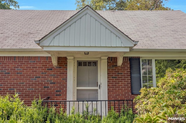 33 Ravine Dr, Hawthorne, NJ 07506 - property entrance featuring brick siding and a shingled roof