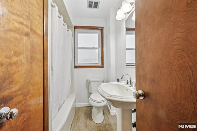 363 Amherst St, Wyckoff, NJ 07481 - bathroom with wood finished floors, shower / tub combo, and ornamental molding