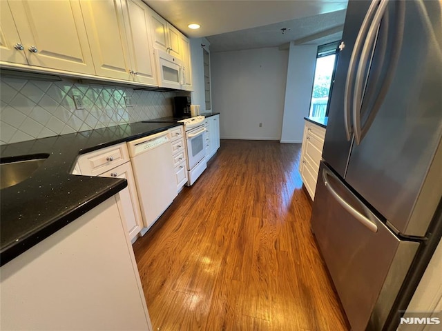 245 Prospect Ave Unit 5A, Hackensack, NJ 07601 - kitchen with white appliances, dark wood-type flooring, white cabinetry, backsplash, and recessed lighting