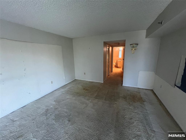 245 Prospect Ave Unit 5A, Hackensack, NJ 07601 - carpeted empty room featuring a textured ceiling and baseboards