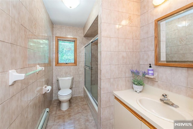 44 Columbus Ave, Totowa, NJ 07512 - bathroom with tile walls, a baseboard radiator, tile patterned flooring, vanity, and bath / shower combo with glass door