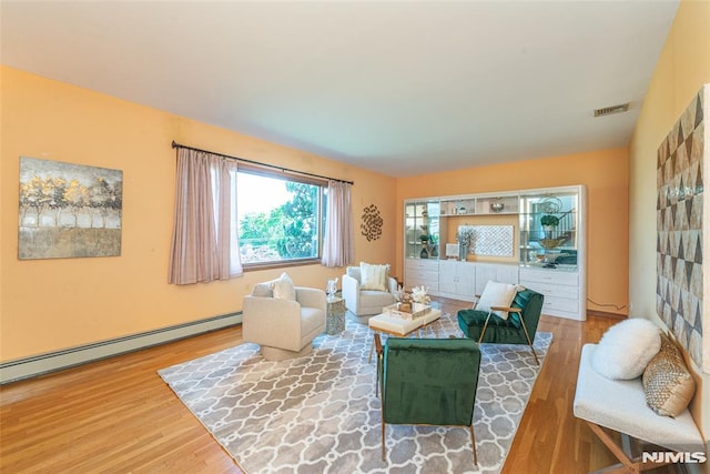 44 Columbus Ave, Totowa, NJ 07512 - living room with wood finished floors and a baseboard radiator