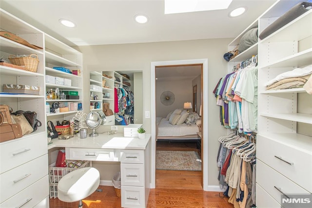 44 Columbus Ave, Totowa, NJ 07512 - spacious closet featuring light wood-style floors and a skylight