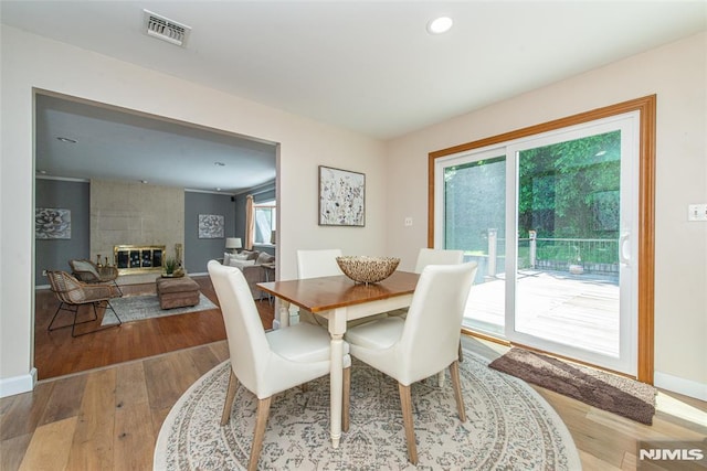 44 Columbus Ave, Totowa, NJ 07512 - dining room featuring wood finished floors, a fireplace, and recessed lighting