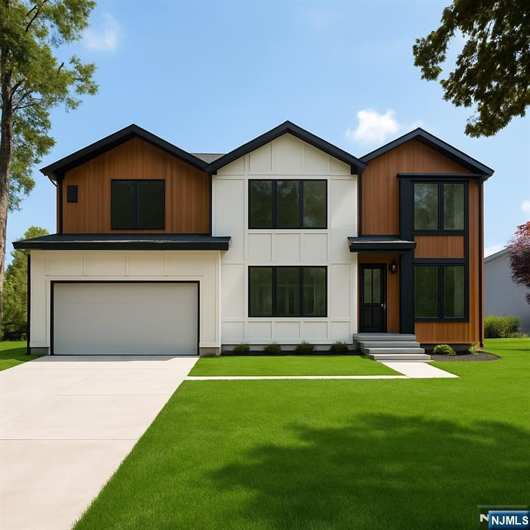 33 Oliver Rd, Paramus, NJ 07652 - modern home with an attached garage, a front yard, and driveway
