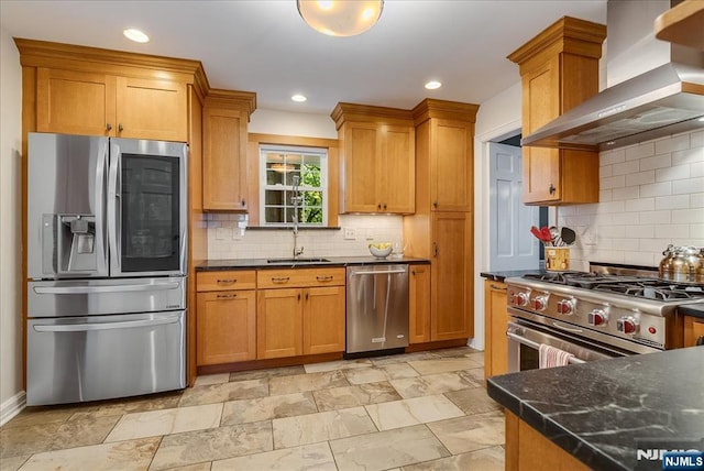35 Hawthorne Ave, Glen Ridge, NJ 07028 - kitchen with stainless steel appliances, wall chimney range hood, tasteful backsplash, brown cabinetry, and recessed lighting