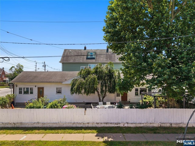 171 Randolph Ave, Clifton, NJ 07011 - view of front facade with a fenced front yard and roof with shingles