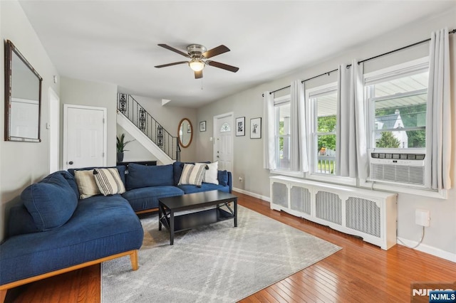 862 Lafayette Ave Extension, Hawthorne, NJ 07506 - living area with radiator heating unit, wood finished floors, stairs, and a ceiling fan