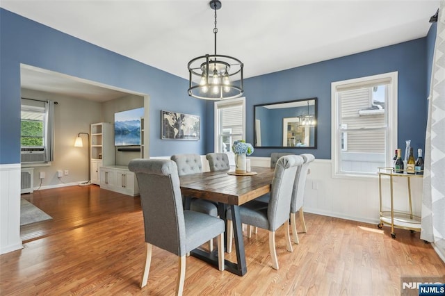 862 Lafayette Ave Extension, Hawthorne, NJ 07506 - dining room featuring a chandelier, wood finished floors, and a wainscoted wall