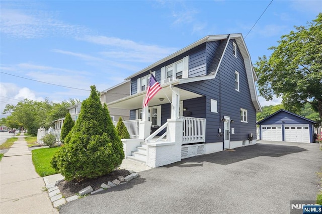 862 Lafayette Ave Extension, Hawthorne, NJ 07506 - view of front facade featuring covered porch, a detached garage, and an outbuilding