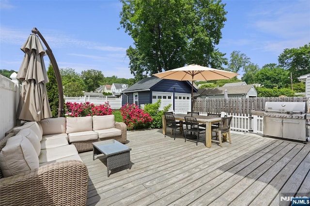862 Lafayette Ave Extension, Hawthorne, NJ 07506 - deck with an outdoor hangout area, outdoor dining area, a fenced backyard, an outdoor structure, and a garage
