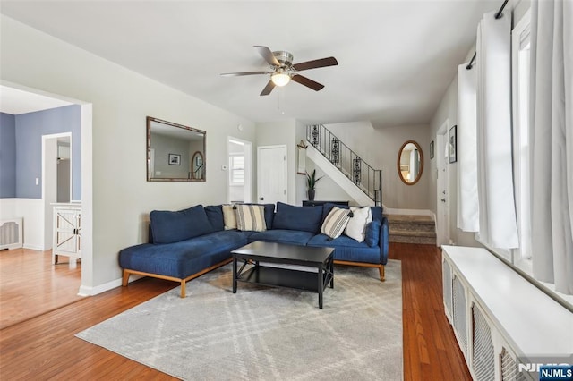 862 Lafayette Ave Extension, Hawthorne, NJ 07506 - living room featuring wood finished floors, stairs, a ceiling fan, and radiator