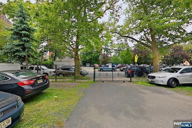 299 7th Ave, Newark, NJ 07107 - view of asphalt street with traffic signs and a gate