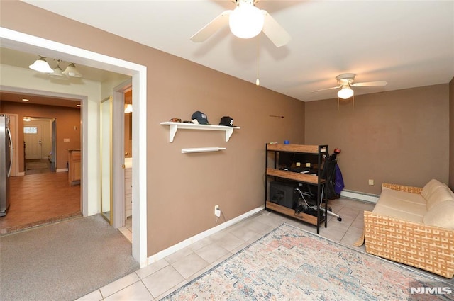 39 Mozart St, East Rutherford, NJ 07073 - home office featuring light tile patterned floors, a baseboard heating unit, and a ceiling fan