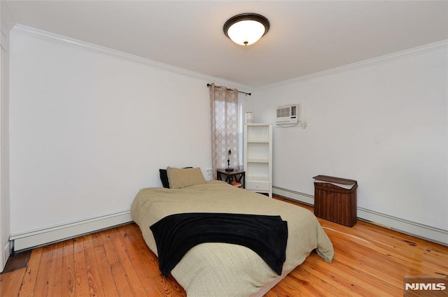 39 Mozart St, East Rutherford, NJ 07073 - bedroom featuring a baseboard heating unit, an AC wall unit, ornamental molding, baseboard heating, and wood-type flooring