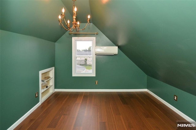 39 Mozart St, East Rutherford, NJ 07073 - bonus room featuring a wall mounted AC, wood finished floors, vaulted ceiling, and a chandelier