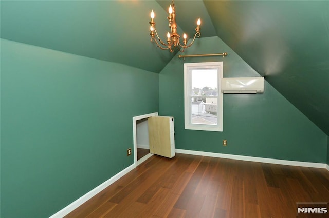 39 Mozart St, East Rutherford, NJ 07073 - additional living space featuring a wall unit AC, a chandelier, wood finished floors, and lofted ceiling