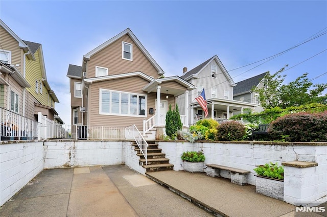 39 Mozart St, East Rutherford, NJ 07073 - traditional home featuring a patio area