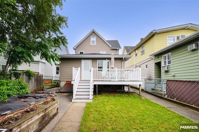 39 Mozart St, East Rutherford, NJ 07073 - view of front of property featuring a deck, a wall unit AC, and cooling unit