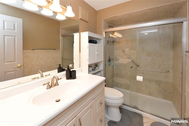 39 Mozart St, East Rutherford, NJ 07073 - bathroom with a stall shower, vanity, and tile walls