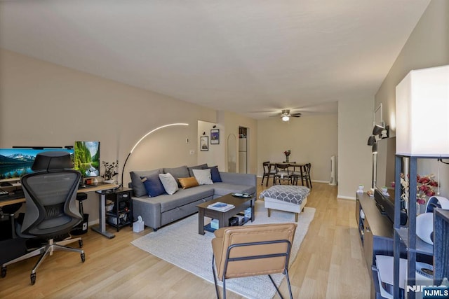 462 Liberty St Unit 109, Little Ferry, NJ 07643 - living area featuring light wood finished floors, a ceiling fan, and a desk