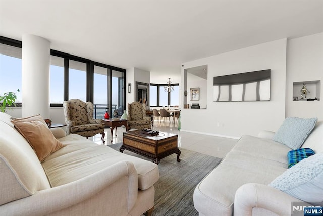 100 Carlyle Dr Unit 12K-S, Cliffside Park, NJ 07010 - tiled living room with baseboards and a chandelier