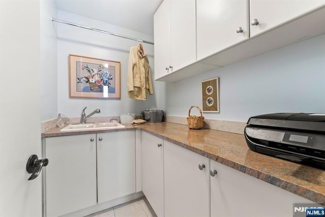 100 Carlyle Dr Unit 12K-S, Cliffside Park, NJ 07010 - kitchen with white cabinetry and light tile patterned floors