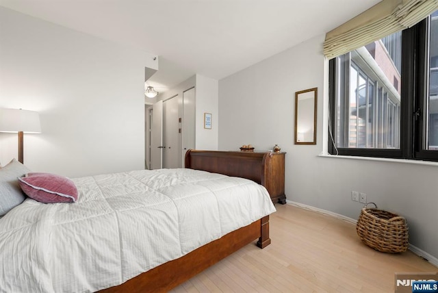 100 Carlyle Dr Unit 12K-S, Cliffside Park, NJ 07010 - bedroom featuring wood finished floors and baseboards