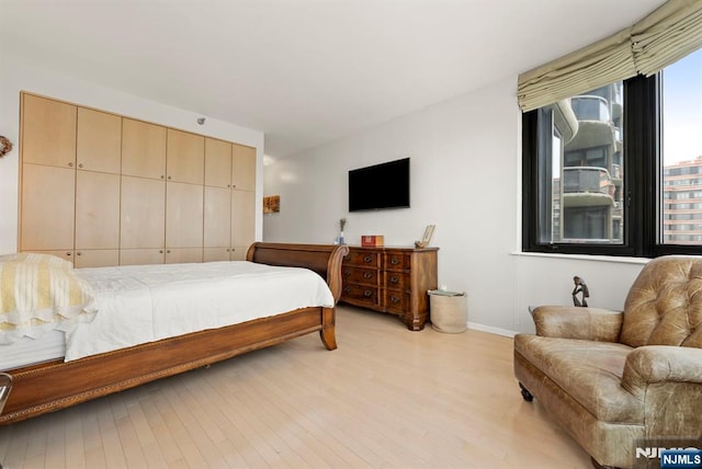 100 Carlyle Dr Unit 12K-S, Cliffside Park, NJ 07010 - bedroom with baseboards and light wood-style floors
