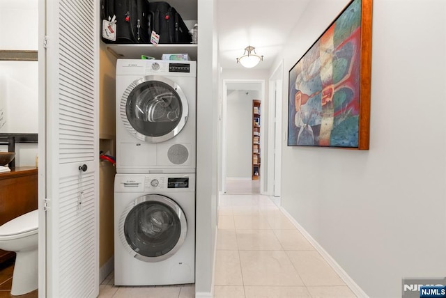 100 Carlyle Dr Unit 12K-S, Cliffside Park, NJ 07010 - laundry area with stacked washer / drying machine and tile patterned floors