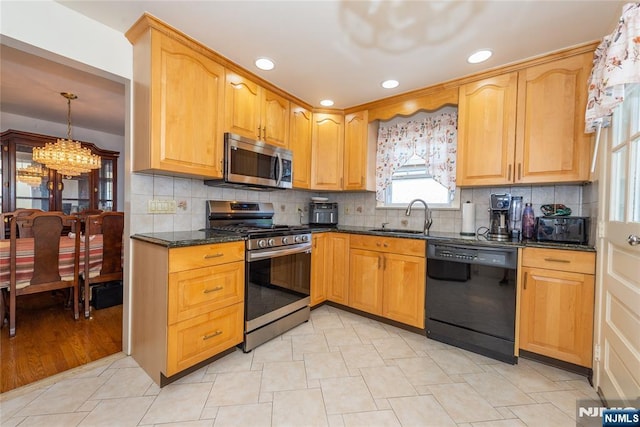 55 Rowland Ave, Hackensack, NJ 07601 - kitchen featuring stainless steel appliances, a chandelier, dark stone countertops, tasteful backsplash, and recessed lighting