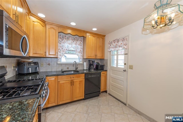 55 Rowland Ave, Hackensack, NJ 07601 - kitchen with appliances with stainless steel finishes, healthy amount of natural light, decorative backsplash, a chandelier, and recessed lighting