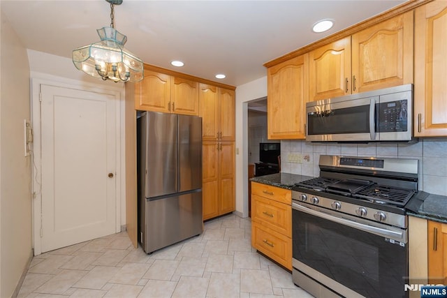 55 Rowland Ave, Hackensack, NJ 07601 - kitchen with stainless steel appliances, dark stone countertops, recessed lighting, decorative backsplash, and a chandelier