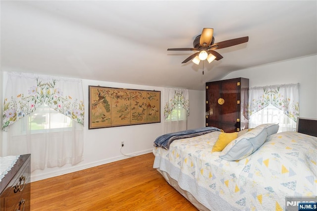 55 Rowland Ave, Hackensack, NJ 07601 - bedroom with light wood-style floors, vaulted ceiling, and a ceiling fan