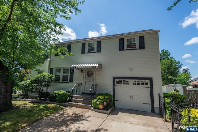 55 Rowland Ave, Hackensack, NJ 07601 - view of front of property featuring a garage and driveway