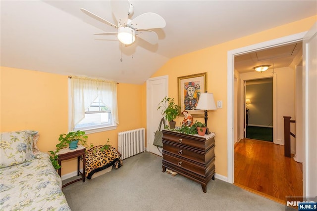 55 Rowland Ave, Hackensack, NJ 07601 - sitting room featuring radiator heating unit, attic access, lofted ceiling, a ceiling fan, and light colored carpet