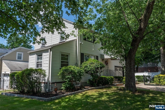 55 Rowland Ave, Hackensack, NJ 07601 - view of side of home featuring a lawn